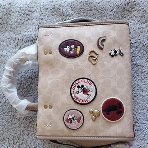 Coach 1941 disney rogue 25 with Disney patches